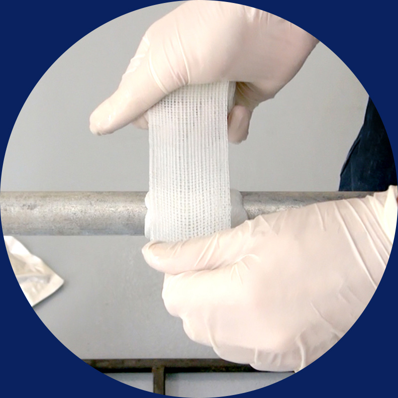 hands repair pipeline using fiberglass polyurethane soaked reisin bandage and a putty