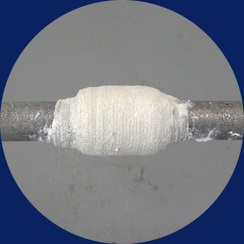 pipeline repaired using fiberglass polyurethane soaked reisin bandage and a putty